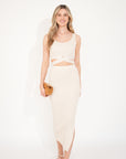 Knitted bodycon style vest top with tie up design and midi pencil skirt co-ords set in beige