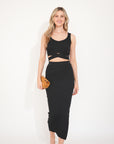 Knitted bodycon style vest top with tie up design and midi pencil skirt co-ords set in black