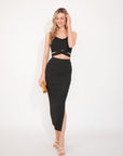 Knitted bodycon style vest top with tie up design and midi pencil skirt co-ords set in black