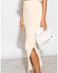 Knitted bodycon style vest top with tie up design and midi pencil skirt co-ords set in beige