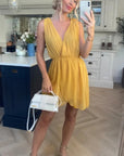 Sleeveless Mini Wrap Dress in mustard yellow color