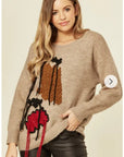 Un-finished tassel fringed knitted jumper