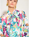 Wild Bloom multi color print oversized shirt with tie up bow design in white