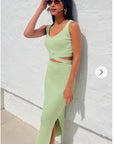 Knitted bodycon style vest top with tie up design and midi pencil skirt co-ords set in green