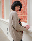 Un-finished tassel fringed knitted jumper