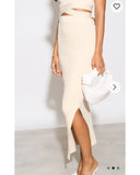 Knitted bodycon style vest top with tie up design and midi pencil skirt co-ords set in beige