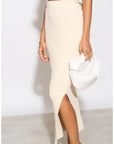 Knitted bodycon style vest top with tie up design and midi pencil skirt co-ords set in beige