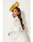 Fascinator With Feather & Sculptural Loop Detail In Gold