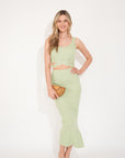 Knitted bodycon style vest top with tie up design and midi pencil skirt co-ords set in green