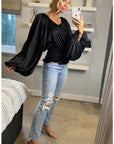 Puff sleeve smocked top in black