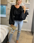 Puff sleeve smocked top in black
