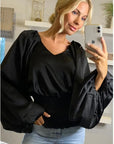 Puff sleeve smocked top in black