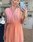 Sleeveless Mini Wrap Dress in peach pink color