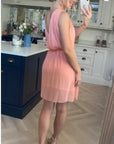 Sleeveless Mini Wrap Dress in peach pink color