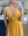 Sleeveless Mini Wrap Dress in mustard yellow color
