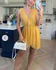 Sleeveless Mini Wrap Dress in mustard yellow color