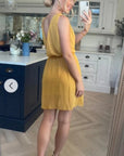 Sleeveless Mini Wrap Dress in mustard yellow color
