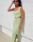 Knitted bodycon style vest top with tie up design and midi pencil skirt co-ords set in green