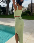 Knitted bodycon style vest top with tie up design and midi pencil skirt co-ords set in green