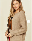 Un-finished tassel fringed knitted jumper