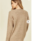 Un-finished tassel fringed knitted jumper