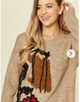 Un-finished tassel fringed knitted jumper