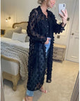 Oversized long shirt dress with floral embellished design in black