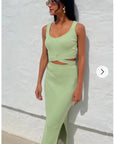 Knitted bodycon style vest top with tie up design and midi pencil skirt co-ords set in green