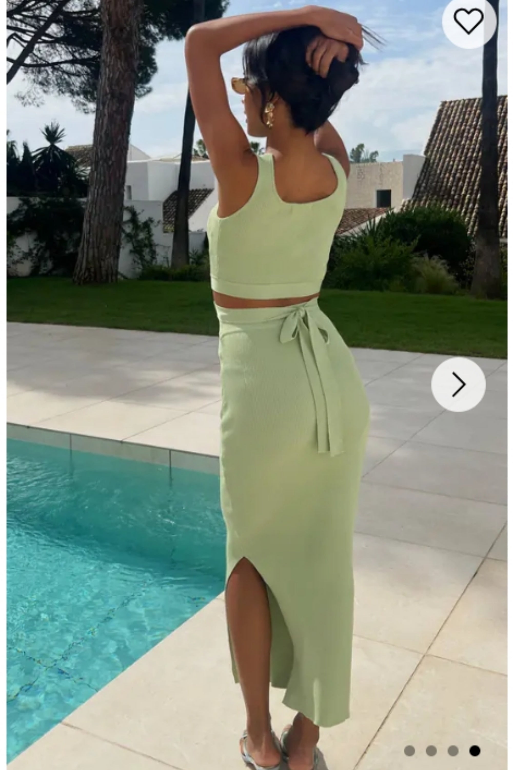 Knitted bodycon style vest top with tie up design and midi pencil skirt co-ords set in green