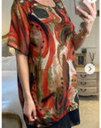 Oversized Short Sleeve Tunic In Orange And Black Abstract Print