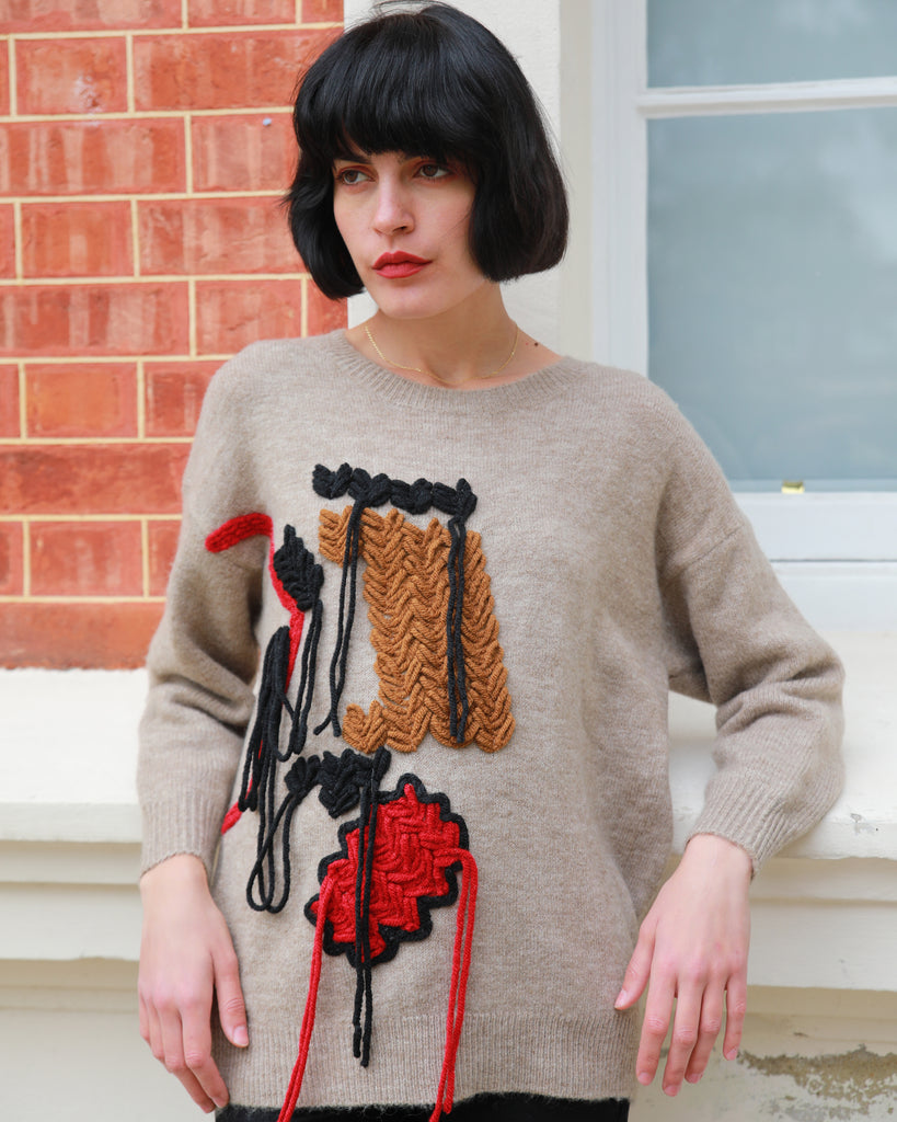 Un-finished tassel fringed knitted jumper